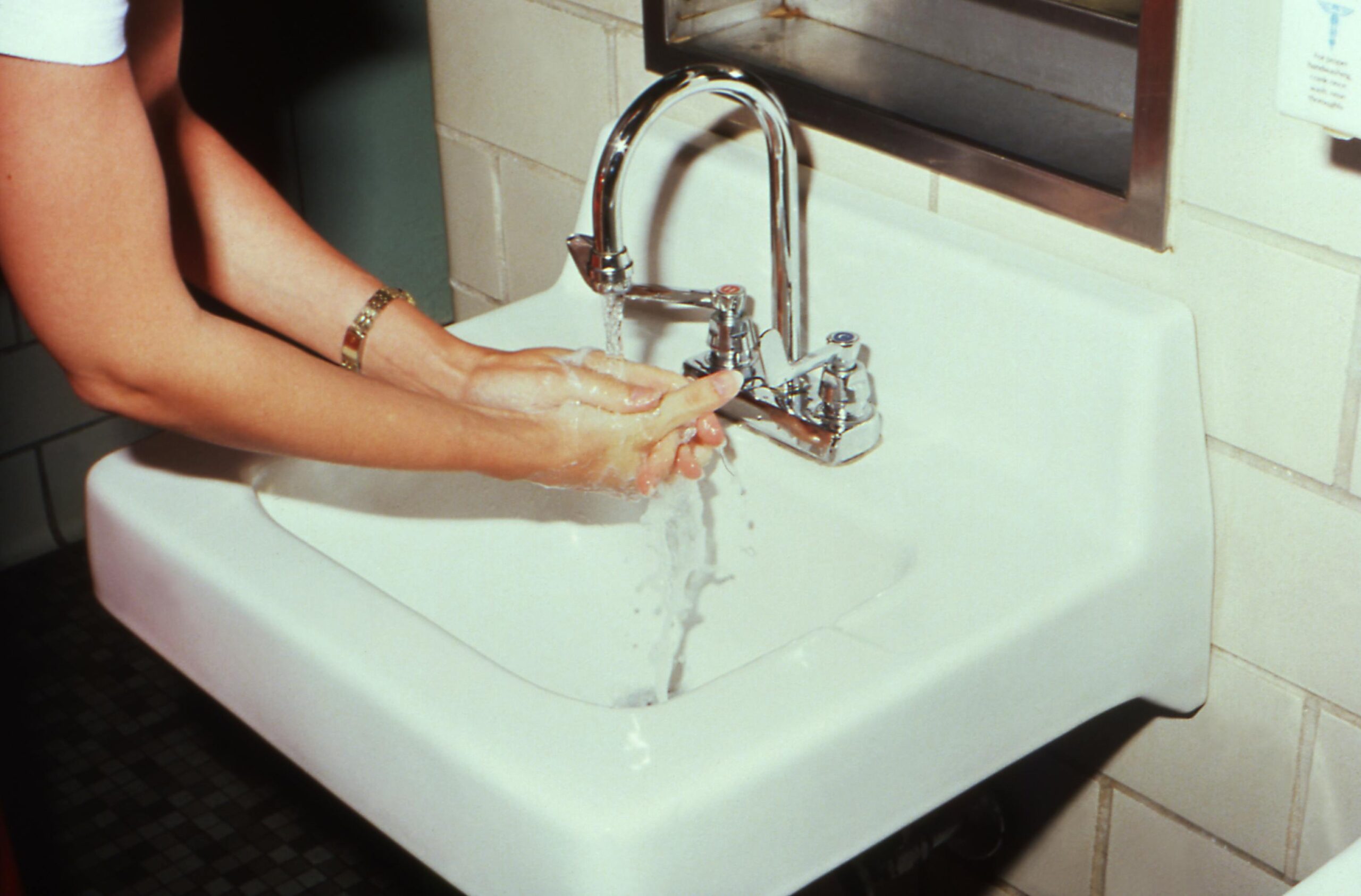 washing hands in restroom trailer